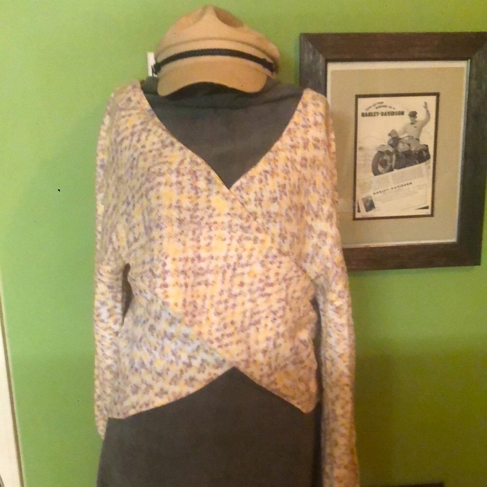 Off the shoulder, cross over front size L sweater.  Fits med-lg